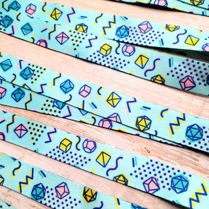 90s Dice Lanyard - Geeky merchandise for people who play D&D - Merch to wear and cute accessories and stationery Paola's Pixels