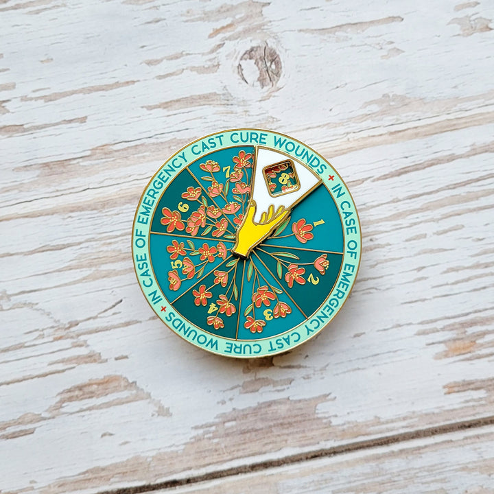Cure Wounds Spinner Pin - Geeky merchandise for people who play D&D - Merch to wear and cute accessories and stationery Paola's Pixels