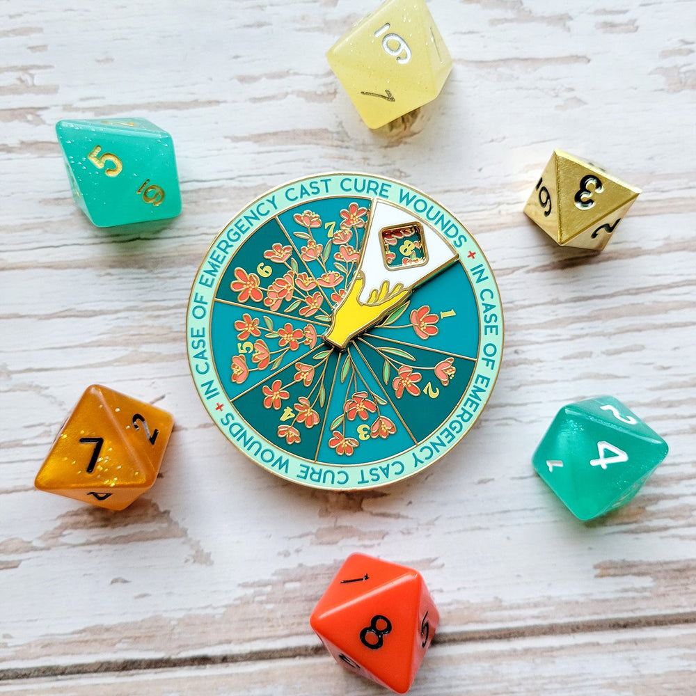 Seconds Sale! Cure Wounds Spinner Pin - Geeky merchandise for people who play D&D - Merch to wear and cute accessories and stationery Paola's Pixels