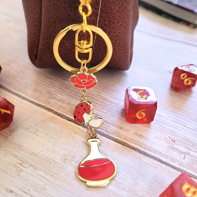Red Potion Enamel Keychain - Geeky merchandise for people who play D&D - Merch to wear and cute accessories and stationery Paola's Pixels