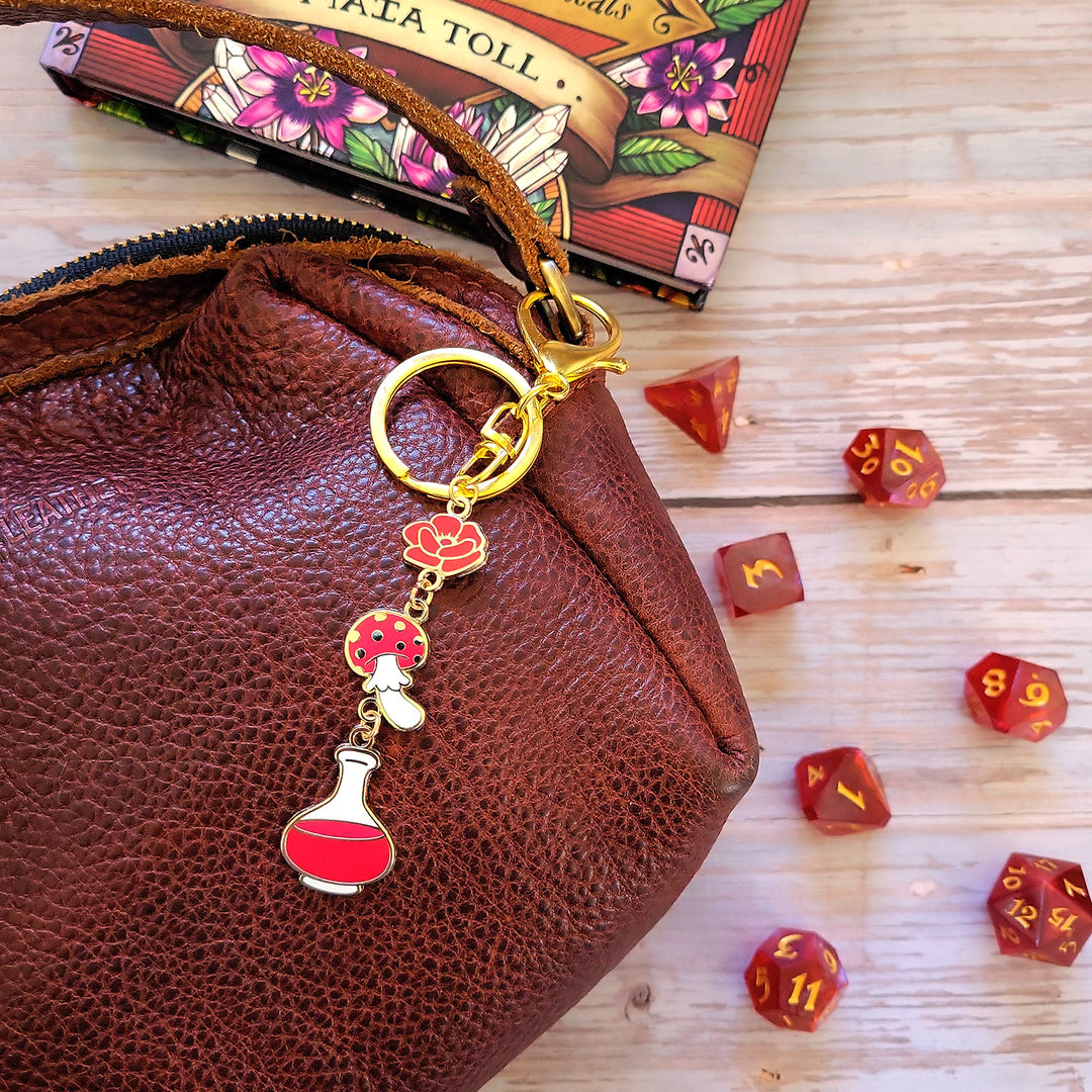 Red Potion Enamel Keychain - Geeky merchandise for people who play D&D - Merch to wear and cute accessories and stationery Paola's Pixels