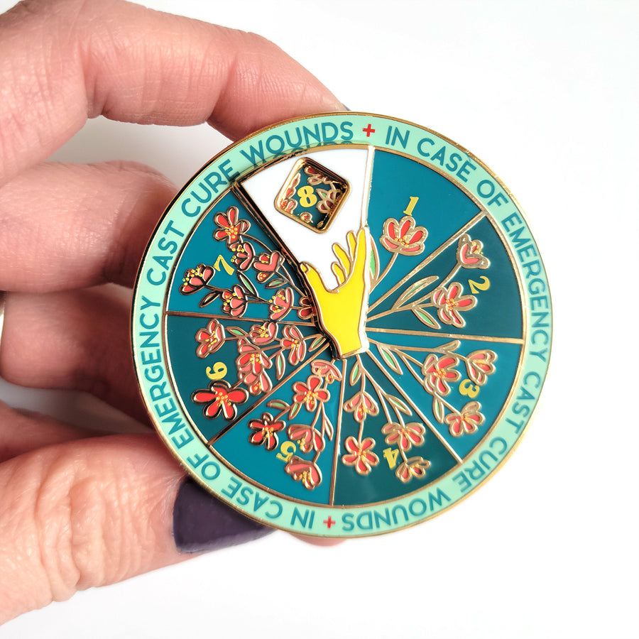 Seconds Sale! Cure Wounds Spinner Pin - Geeky merchandise for people who play D&D - Merch to wear and cute accessories and stationery Paola's Pixels