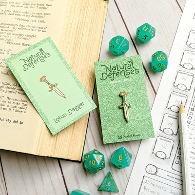 Lotus Dagger Pin - Geeky merchandise for people who play D&D - Merch to wear and cute accessories and stationery Paola's Pixels