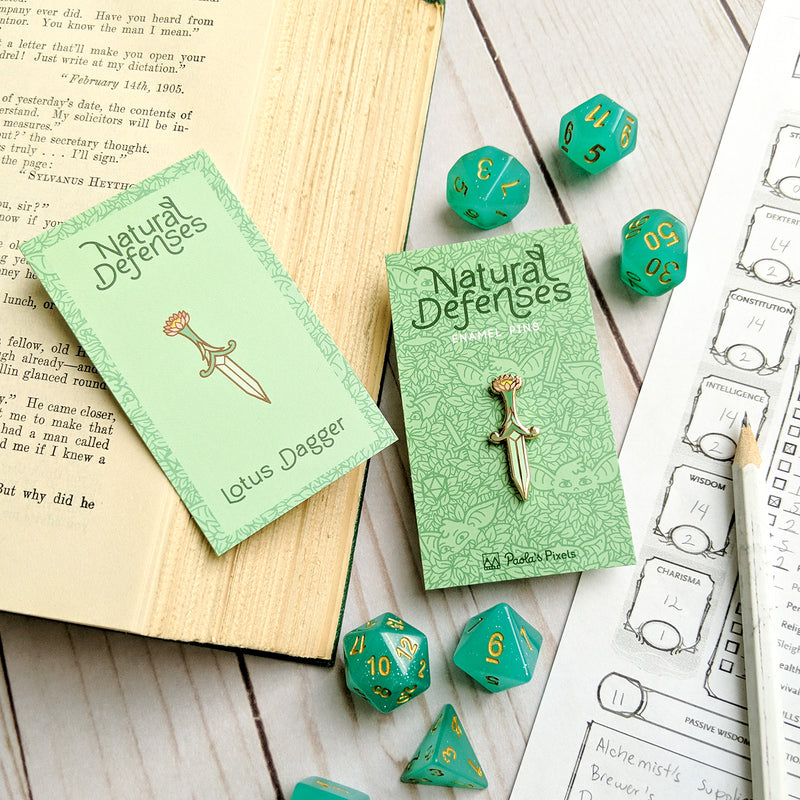 Lotus Dagger Pin - Geeky merchandise for people who play D&D - Merch to wear and cute accessories and stationery Paola&