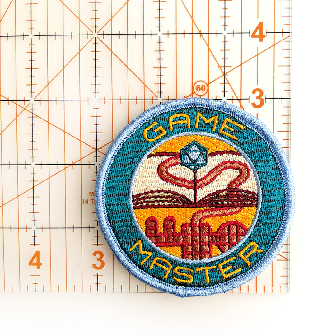 Game Master Patch - Geeky merchandise for people who play D&D - Merch to wear and cute accessories and stationery Paola's Pixels