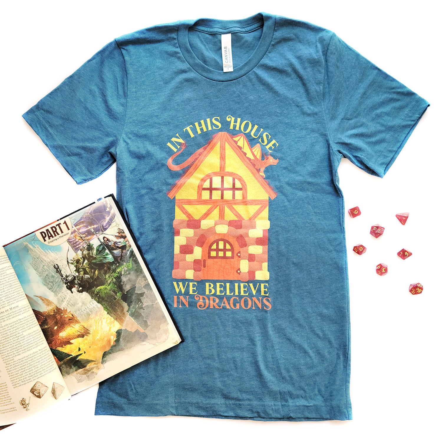 In This House We Believe In Dragons Shirt - Geeky merchandise for people who play D&D - Merch to wear and cute accessories and stationery Paola's Pixels