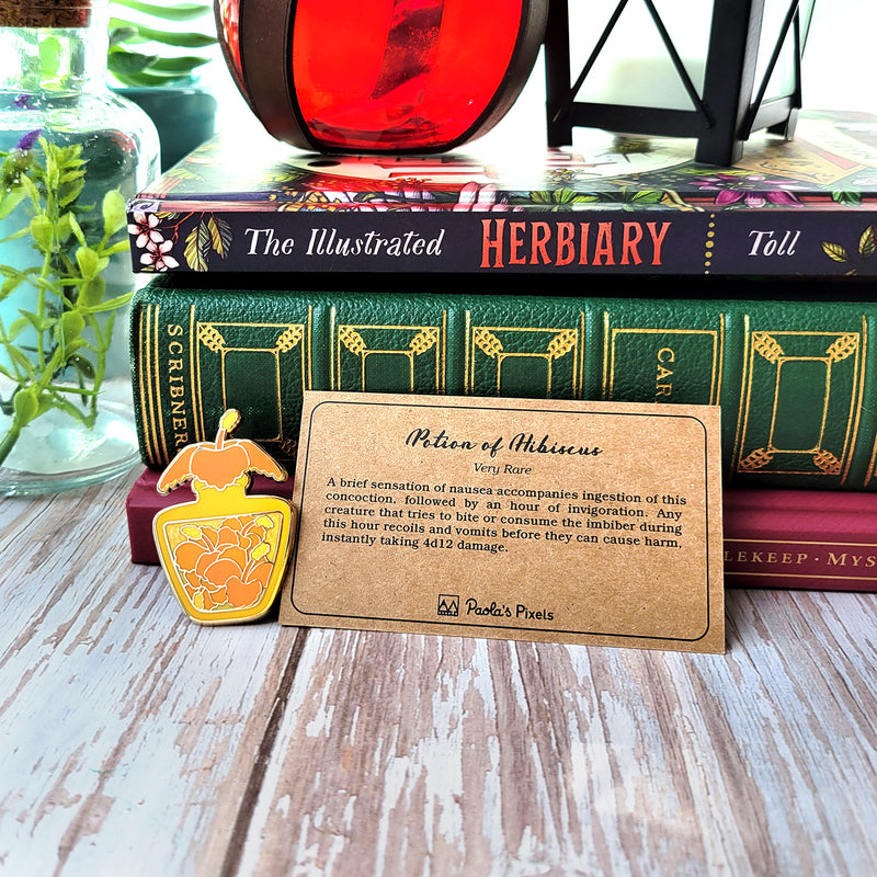 Orange Hibiscus Potion Enamel Pin - Geeky merchandise for people who play D&D - Merch to wear and cute accessories and stationery Paola&