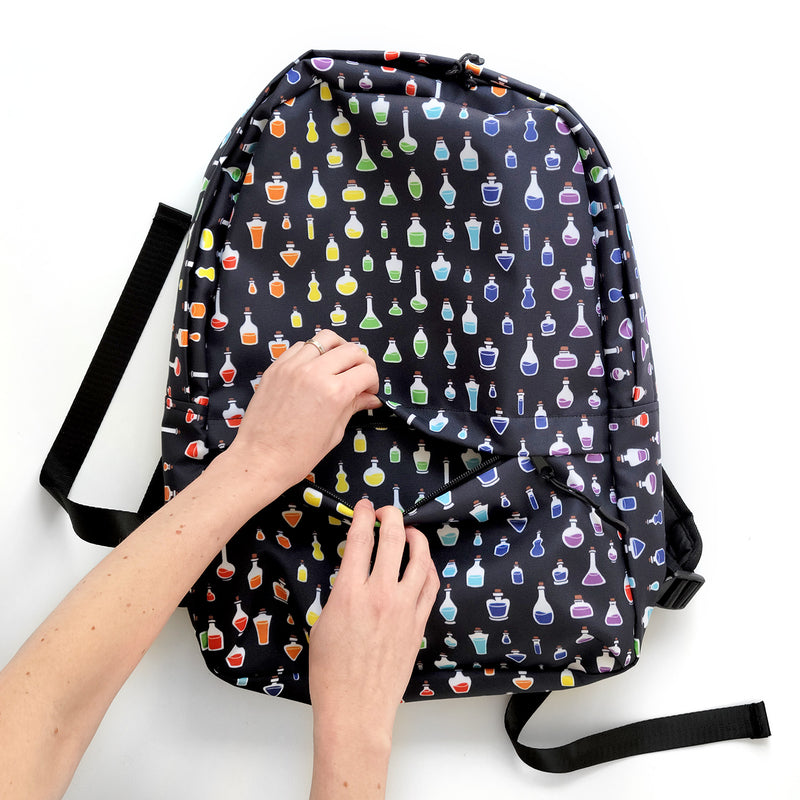 Rainbow Potions Backpack - Geeky merchandise for people who play D&D - Merch to wear and cute accessories and stationery Paola&