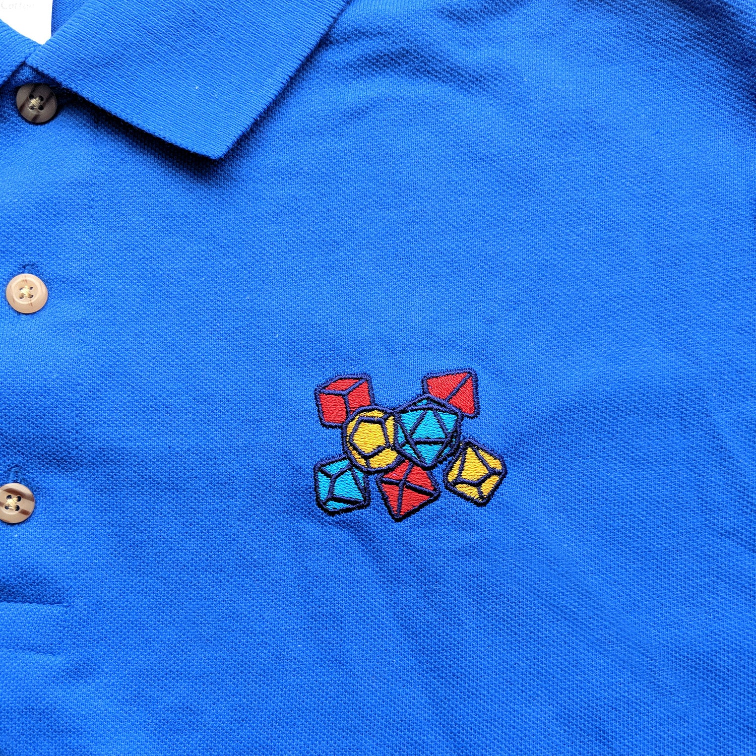 Primary Color Dice Embroidered Polo Shirt - Geeky merchandise for people who play D&D - Merch to wear and cute accessories and stationery Paola's Pixels