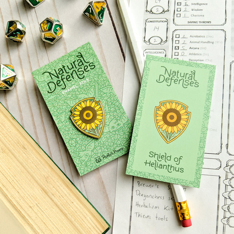 Shield of Helianthus Pin - Geeky merchandise for people who play D&D - Merch to wear and cute accessories and stationery Paola&