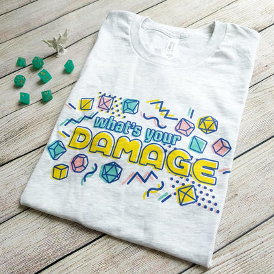What's Your Damage t-Shirt - Geeky merchandise for people who play D&D - Merch to wear and cute accessories and stationery Paola's Pixels