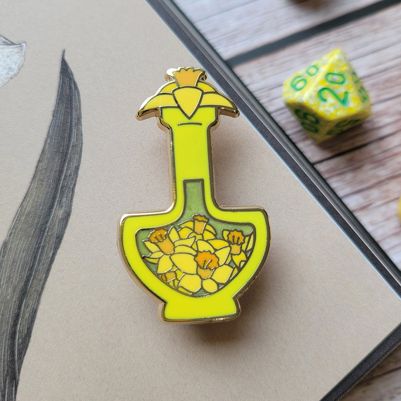 Yellow Daffodil Potion Enamel Pin - Geeky merchandise for people who play D&D - Merch to wear and cute accessories and stationery Paola&
