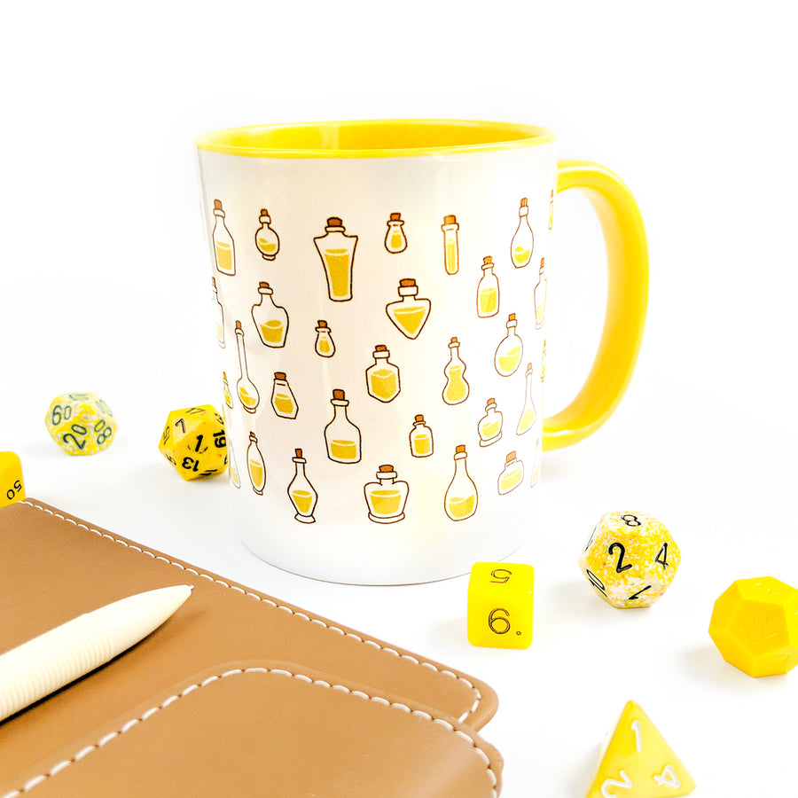 Yellow Stamina Potions Mug - Geeky merchandise for people who play D&D - Merch to wear and cute accessories and stationery Paola's Pixels